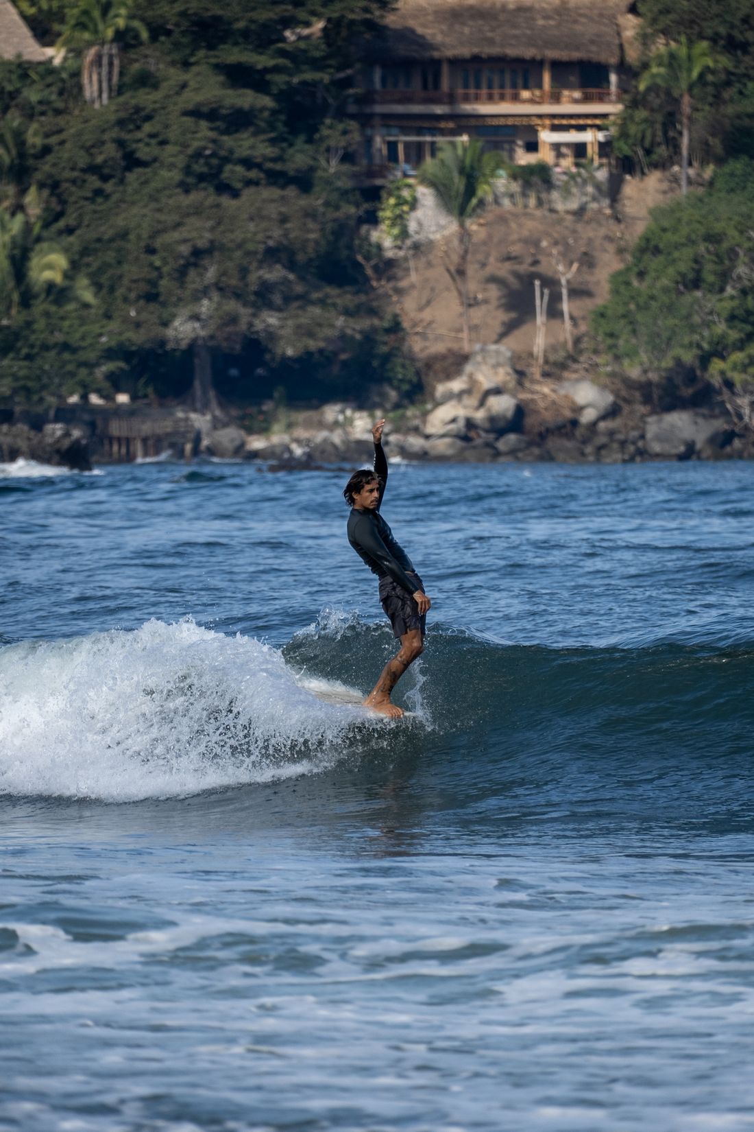 Carlos noseriding a longboard in Sayulita