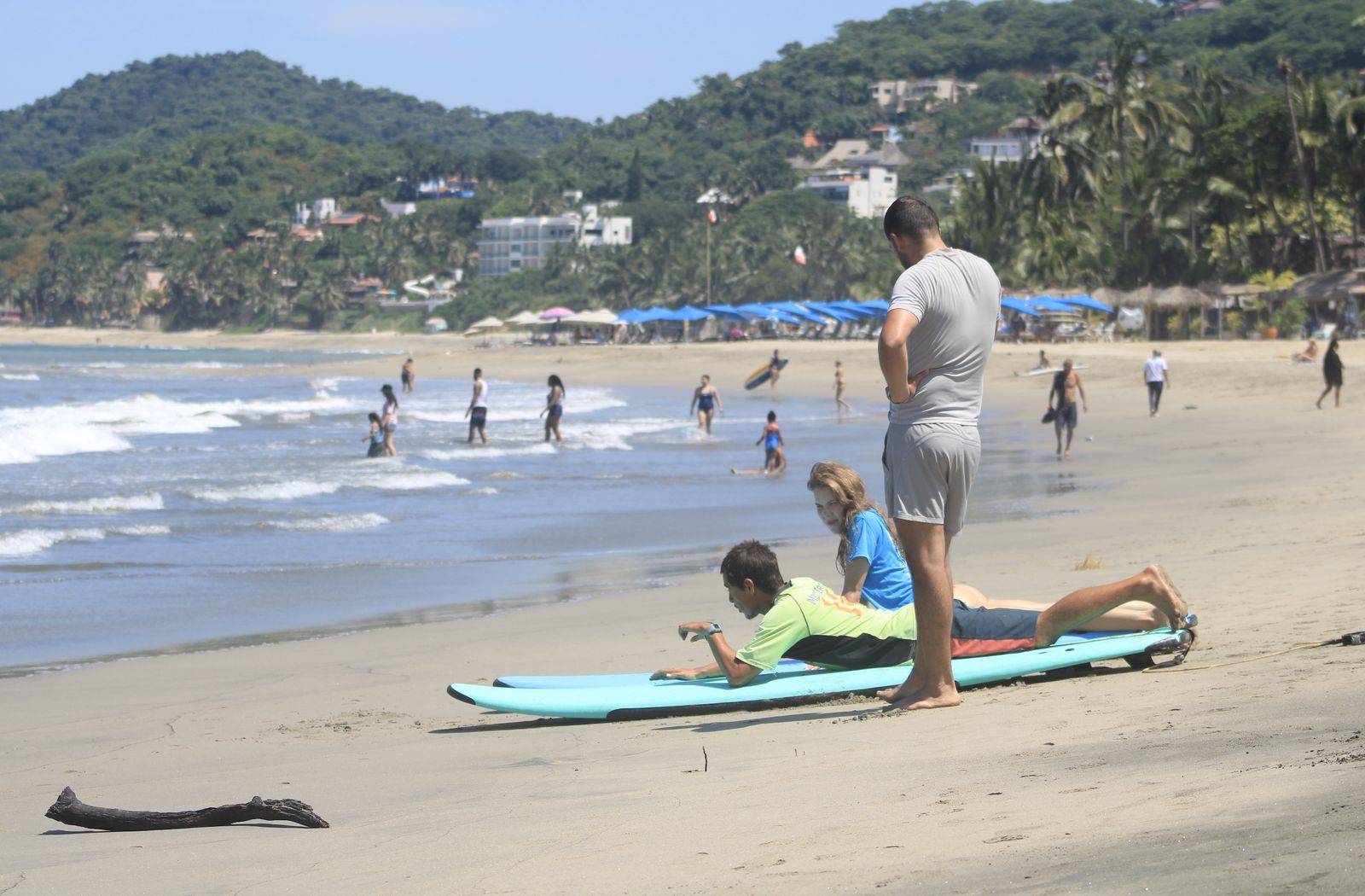 Carlos teaching paddle position on the sand